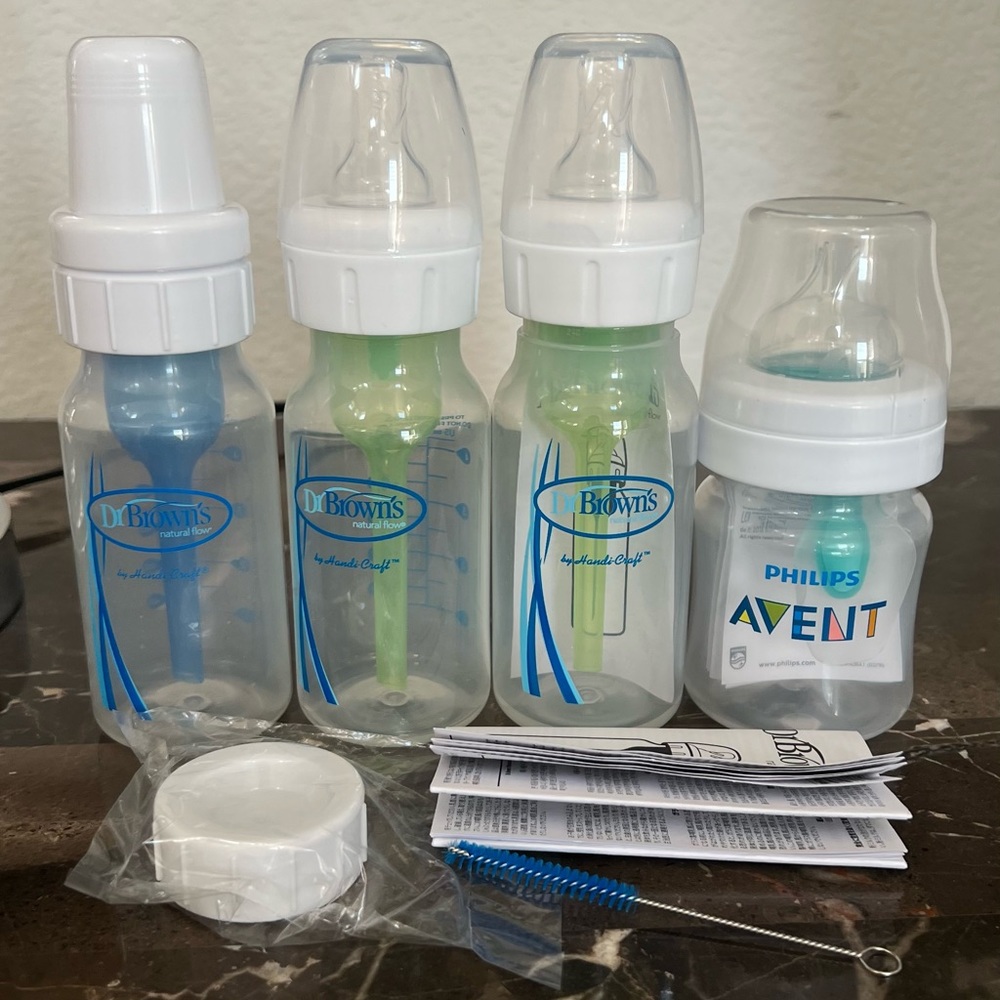 Lot of four brand new baby bottles.